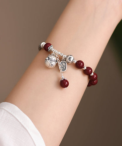 Mulberry Sterling Silver Cinnabar Tassel Charm Bracelet