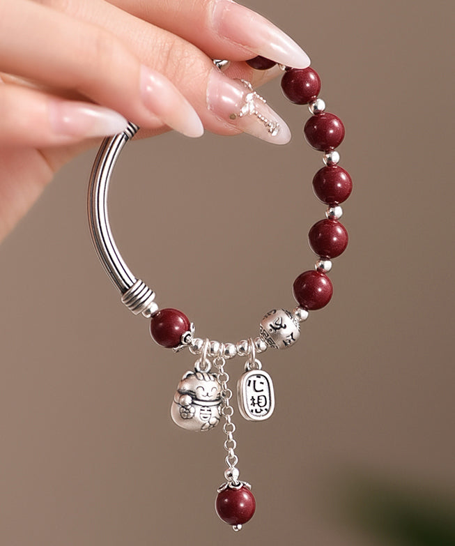 Mulberry Sterling Silver Cinnabar Tassel Charm Bracelet